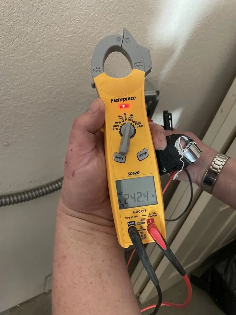 Voltage testing with clamp meter during Outlet Installation in West Columbia